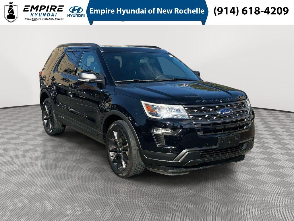 2019 Ford Explorer XLT in Black Metallic — front three-quarter view
