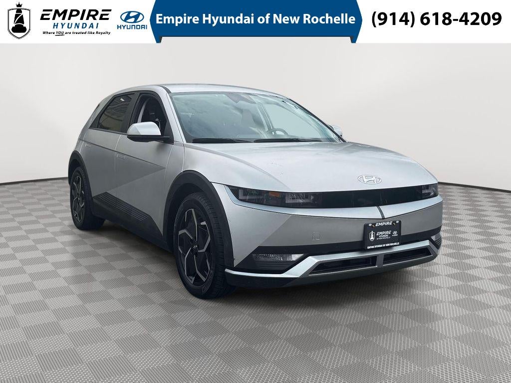 2024 Hyundai IONIQ 5 SEL in Gravity Gold (Matte Gold) — front three-quarter view