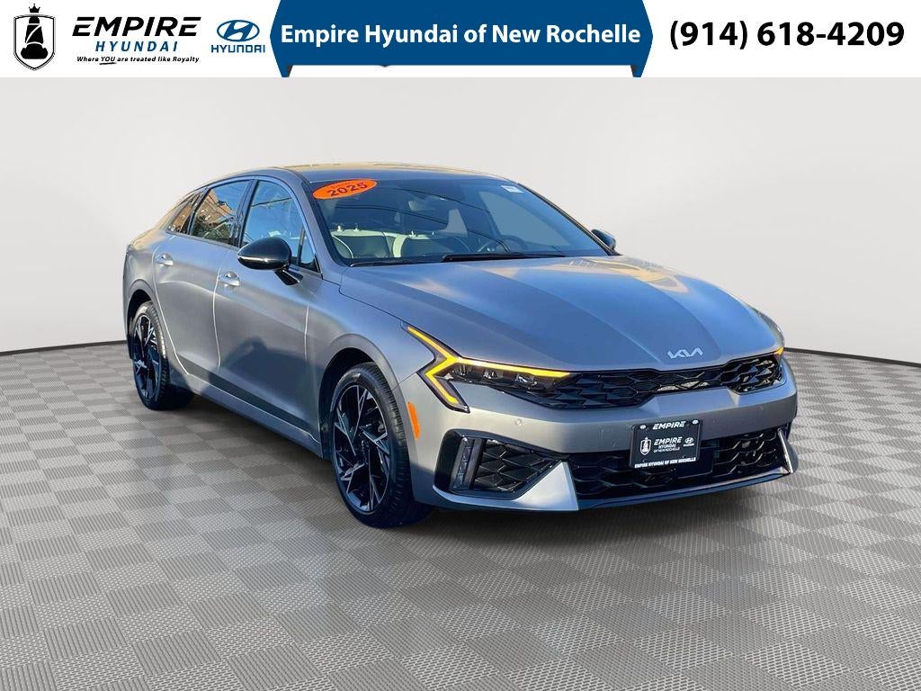 2025 Kia K5 GT-Line in Steel Matte Gray — front three-quarter view