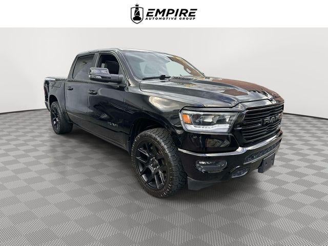 2023 RAM 1500 Laramie in Diamond Black Crystal Pearlcoat — front three-quarter view