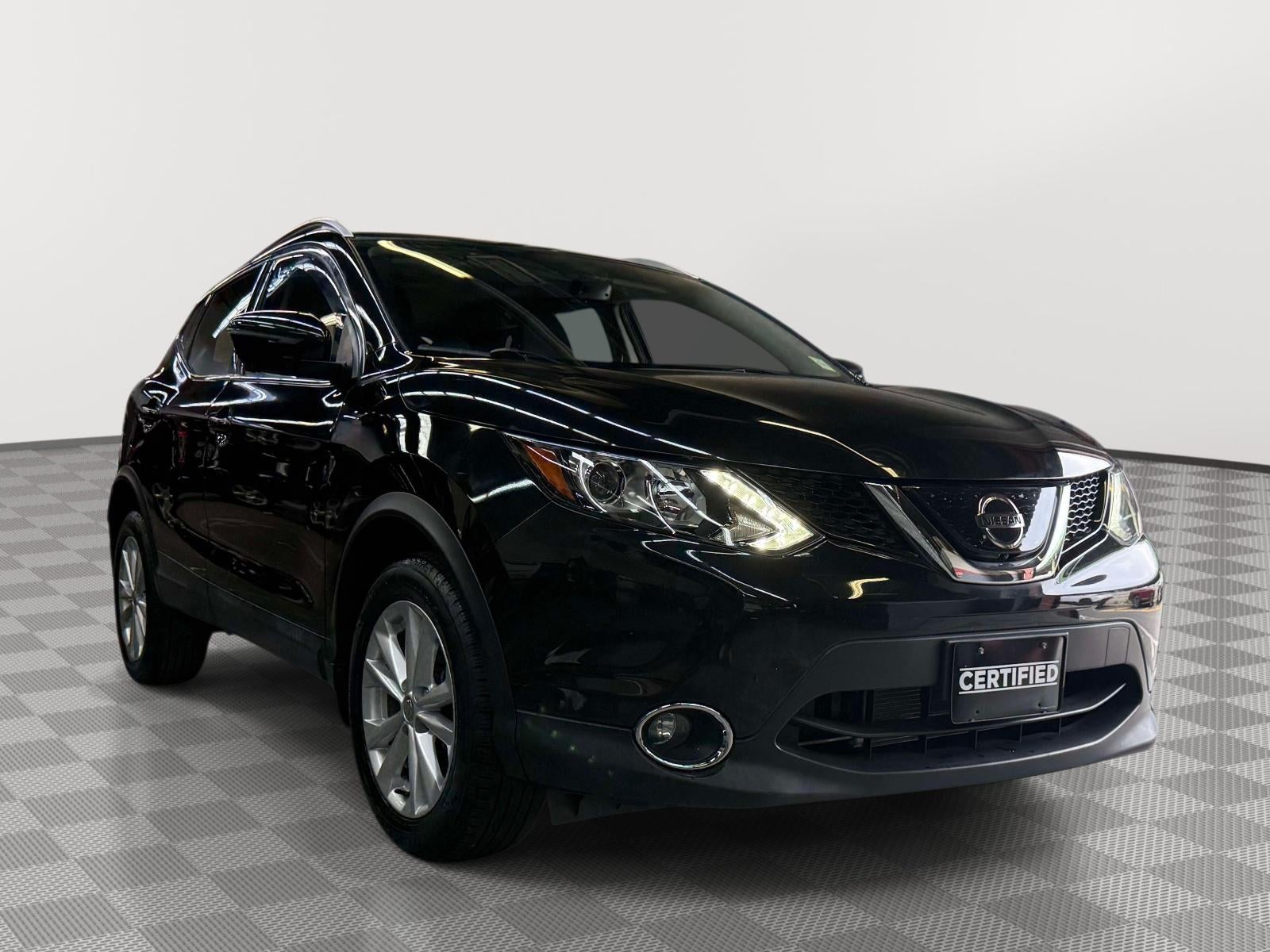 2018 Nissan Rogue Sport SV in Magnetic Black — front three-quarter view