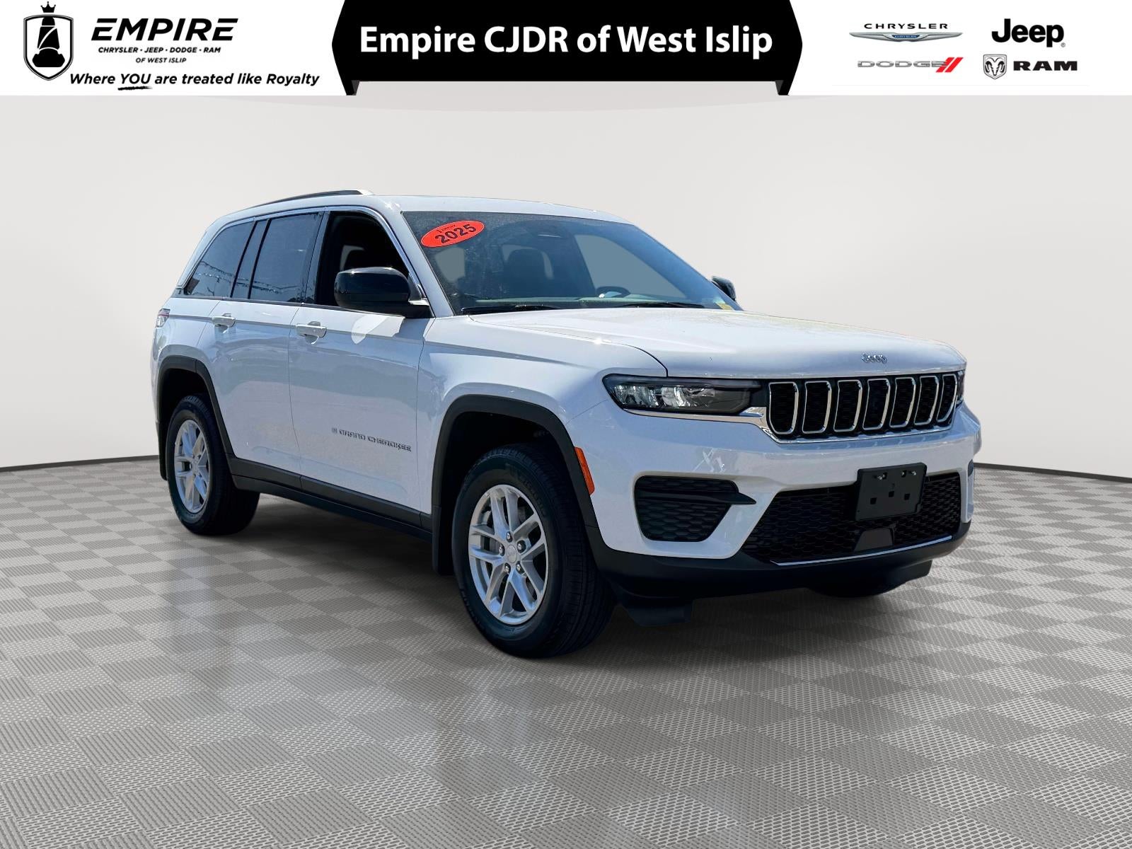 2025 Jeep Grand Cherokee Laredo X in Bright White Clearcoat — front three-quarter view