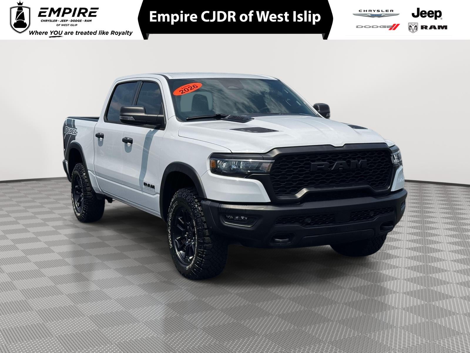 2026 RAM 1500 Rebel Crew Cab 4x4 5'7' Box in Bright White Clearcoat — front three-quarter view