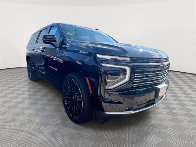 2026 Chevrolet Suburban High Country in Black — front three-quarter view