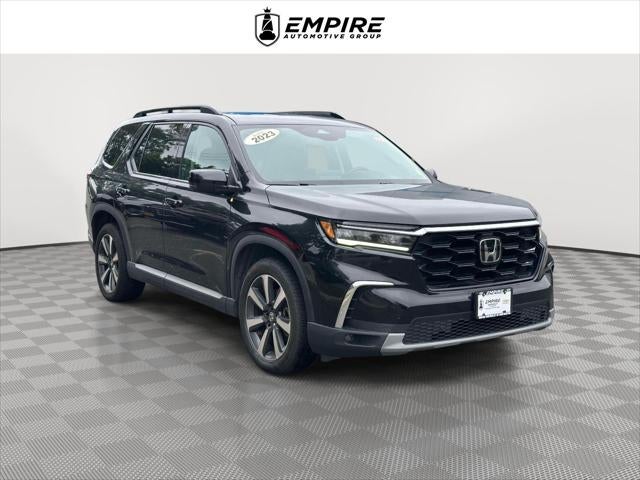 2023 Honda Pilot Touring in Black — front three-quarter view