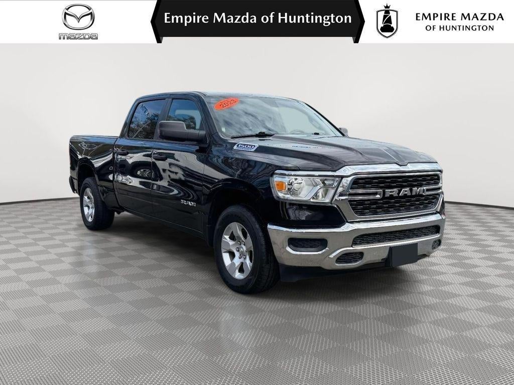 2023 RAM 1500 Big Horn Crew Cab 4x4 64' Box in Diamond Black Crystal Pearlcoat — front three-quarter view